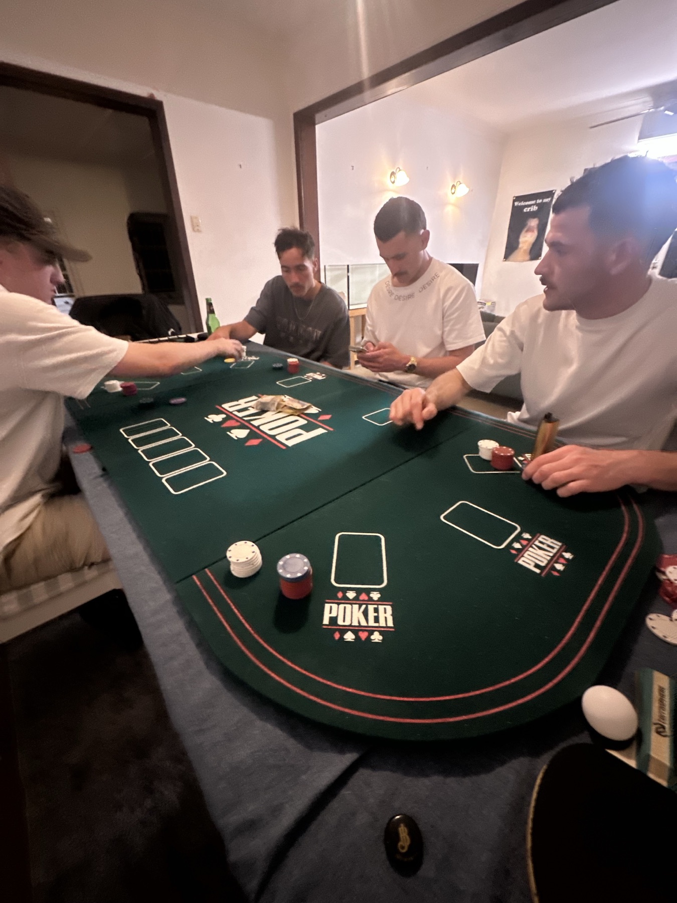 The boys gathered around a poker table