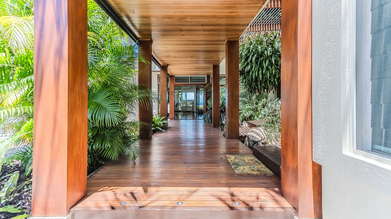 Elysian's long timber walkway through tropical gardens