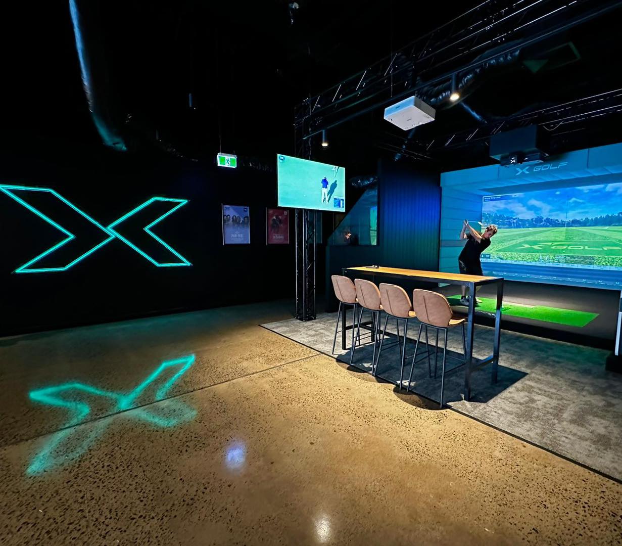 A real simulator bay inside X-Golf Ashmore